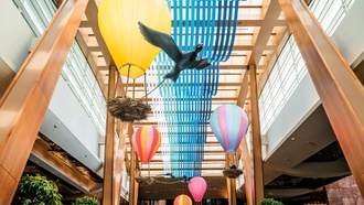 The art display features plenty of colorful hot air balloons.