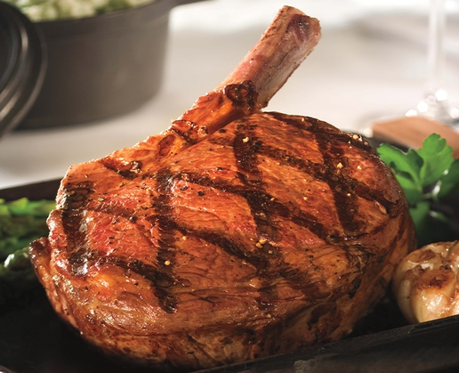 Phil’s Steakhouse has returned to Treasure Island, and so have favorites like the bone-in ribeye chop.
