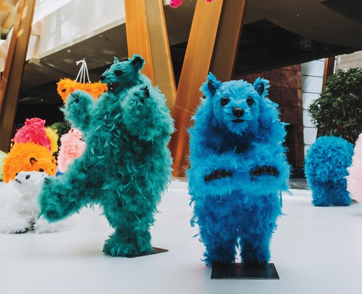 We Are the Baby Gang, consisting of 51 fluorescent baby bears in various scenes, is currently on display at Aria in Las Vegas