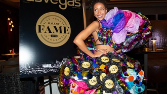 A model from TNG Agency wears a custom dress created from ‘Las Vegas Magazine’ covers by Flock Flock Flock at a private reception to celebrate the publication’s 2022 Hall of Fame class at Legacy Club at Circa Resort & Casino