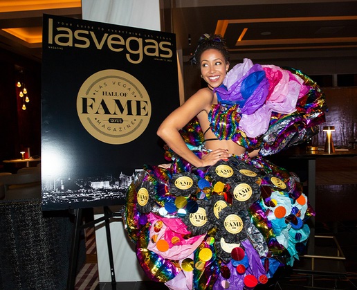 A model from TNG Agency wears a custom dress created from ‘Las Vegas Magazine’ covers by Flock Flock Flock at a private reception to celebrate the publication’s 2022 Hall of Fame class at Legacy Club at Circa Resort & Casino