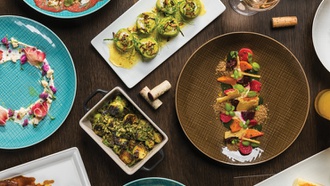 The Mandalay Bay restaurant features a massive wine tower—and wine ‘angels’ to get it for ...