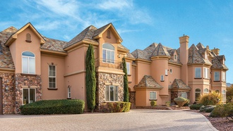 From its turrets to a seven-car, garage, this luxury home is a stunner.