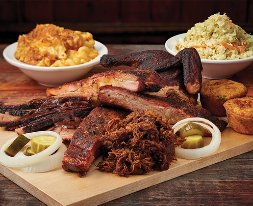 Ribs, brisket and pulled pork alongside macaroni and cheese at Virgil’s Real Barbecue at The Linq Promenade in Las Vegas