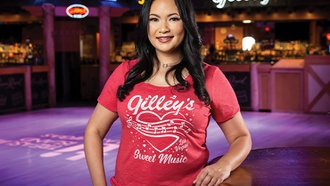 Gilley's bartender makes you feel right at home.