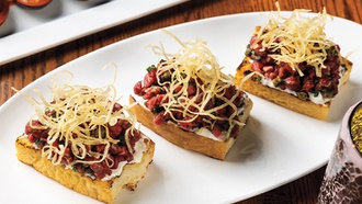 The restaurant is tucked away behind a pawn shop on the third floor of The ...