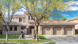 This two-story Mediterranean-style stunner is in close proximity to a world-class golf course.