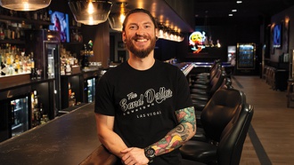 The Sand Dollar bartender has found his happy place.