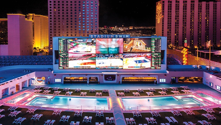 The property’s pool complex Stadium Swim hosts a night of EDM fun.