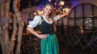 The server at the popular Bavarian-inspired restaurant helps to provide an authentic experience.