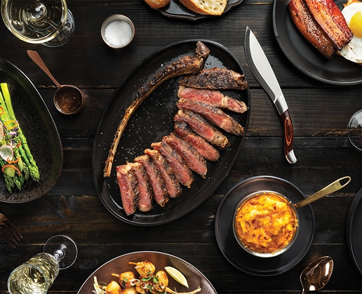 A steak with sides at Bugsy & Meyer's Steakhouse at Flamingo in Las Vegas