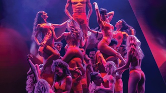 The show at The STRAT combines bawdiness with intriguing variety acts.