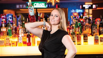 In downtown Las Vegas, this flair bartender breaks the glass ceiling but not the bottles.