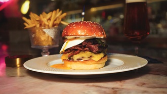 The Resorts World Las Vegas steakhouse offers the bar-exclusive Carver-Steak & Egg Burger—but only for ...