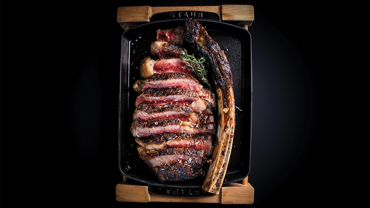 The 21-day dry-aged tomahawk at BOA Steakhouse at The Grand Canal Shoppes at The Venetian Resort in Las Vegas